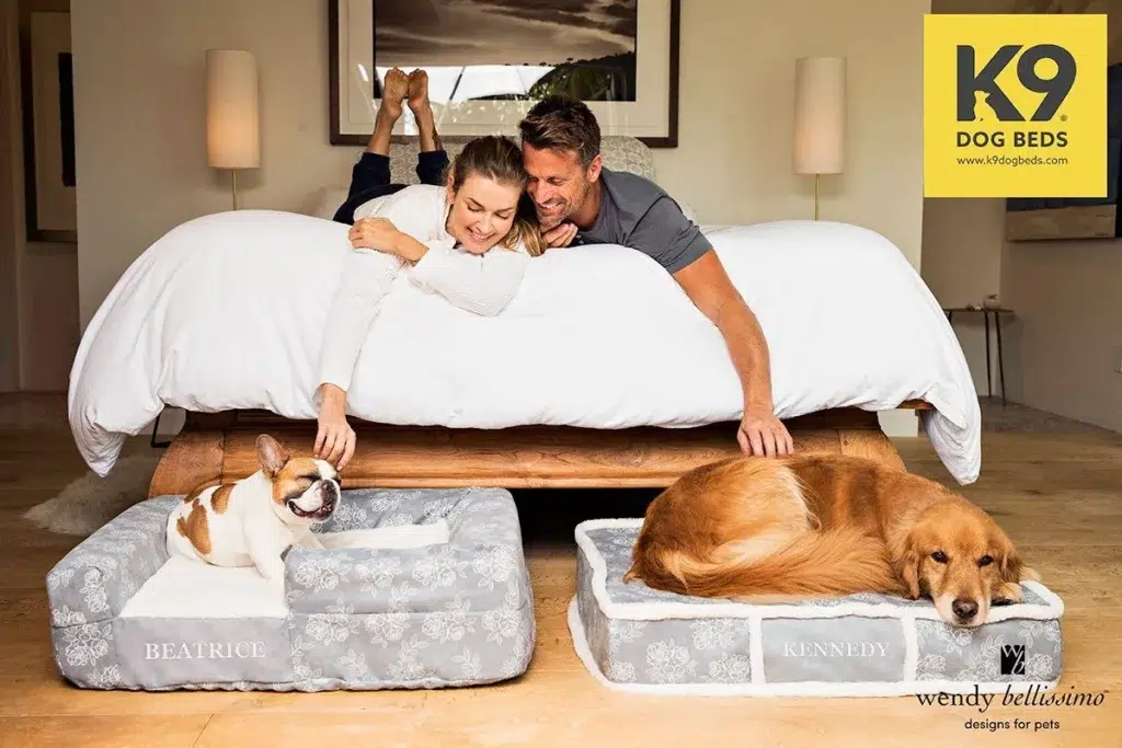 dogs sleep in their beds in the owner's bedroom